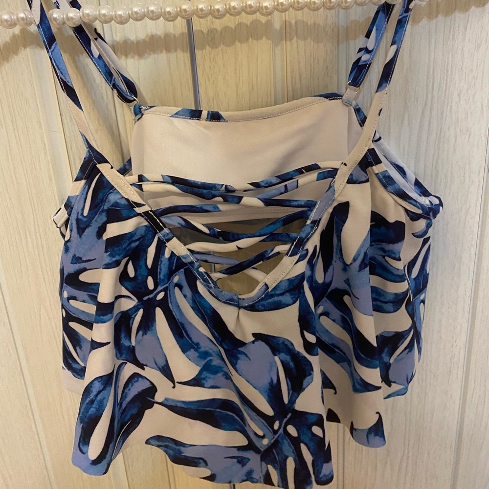 Blue and white ruffled swimsuit top